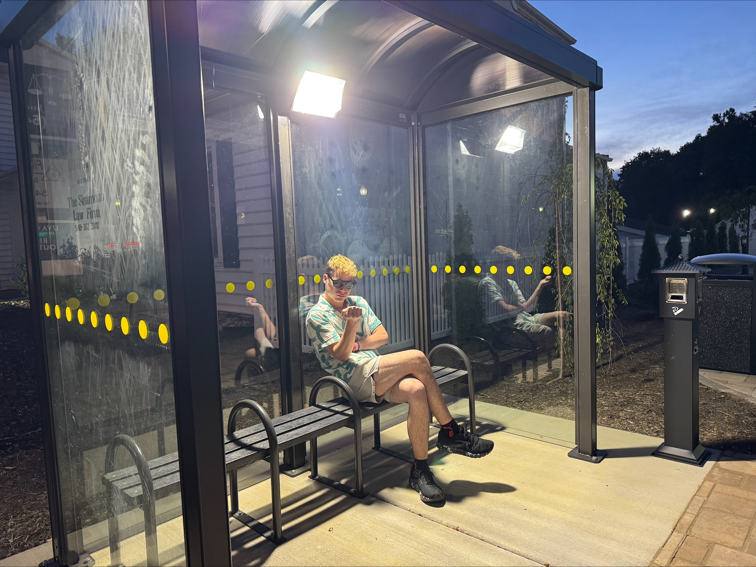 An image of Me sitting in a bus pickup station